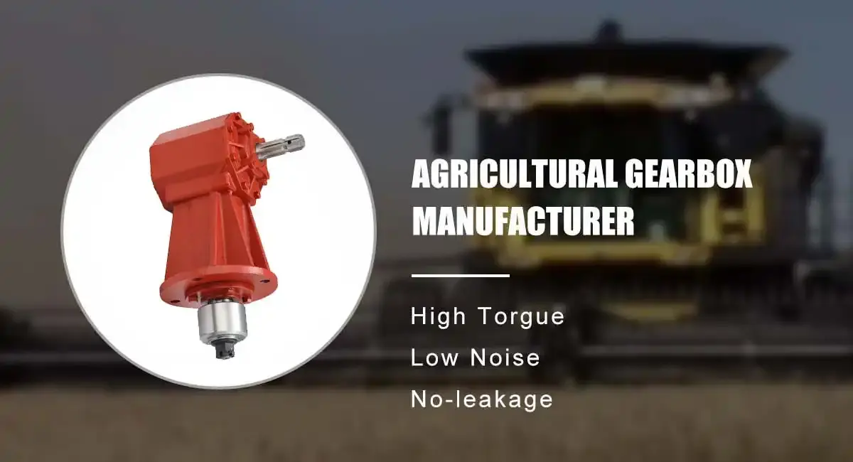 Red agricultural gearbox with vertical and horizontal shafts and a blurred harvester behind it