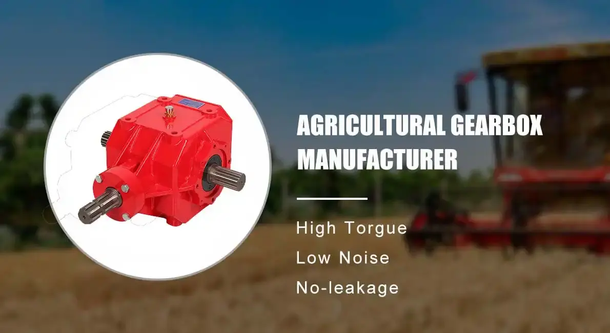 Red three-shaft agricultural gearbox with a blurred harvester in the background